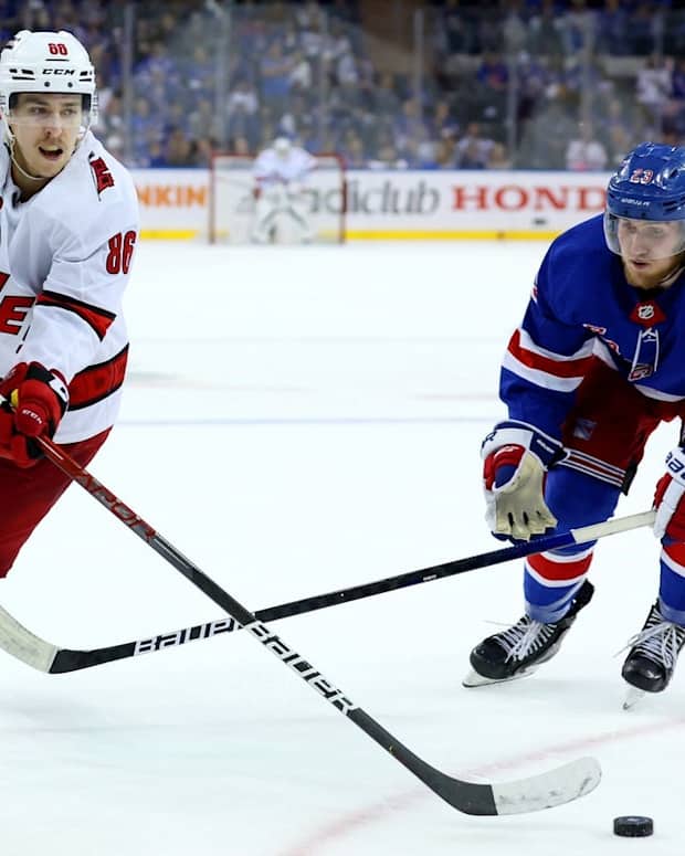 May 28, 2022; New York, New York, USA; Carolina Hurricanes left wing Teuvo Teravainen (86) controls the puck against New York Rangers defenseman Adam Fox (23) during the third period of game six of the second round of the 2022 Stanley Cup Playoffs at Madison Square Garden. Mandatory Credit: Brad Penner-USA TODAY Sports